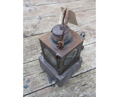 An LNER railway signal lamp interior with reservoir and brass burner