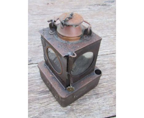 An LNER railway signal lamp interior with reservoir and brass burner 
