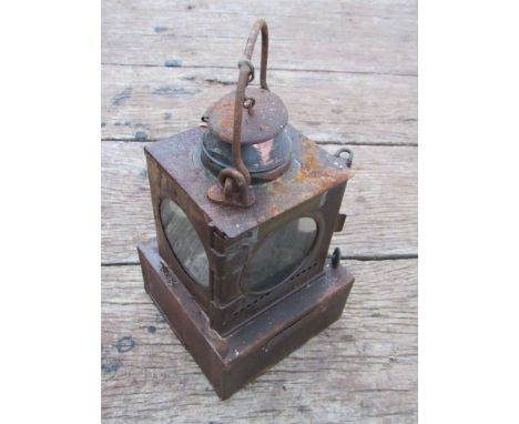 A railway signal lamp interior with reservoir and burner, stamped "LEISTON" 