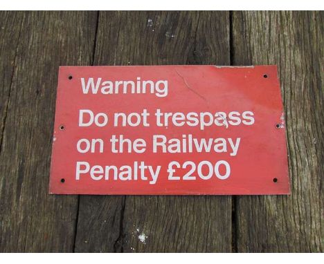 An enamel railway notice sign "WARNING DO NOT TRESPASS ON THE RAILWAY PENALTY £200"