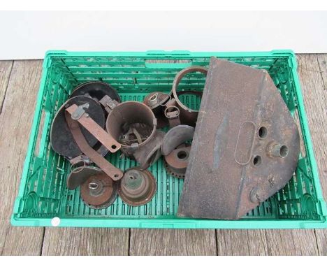 A basket of various oil lamp parts 