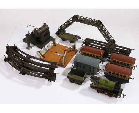 Quantity of O gauge model railway to include green engine and tender, three pullman carriages, track, footbridge, signals etc