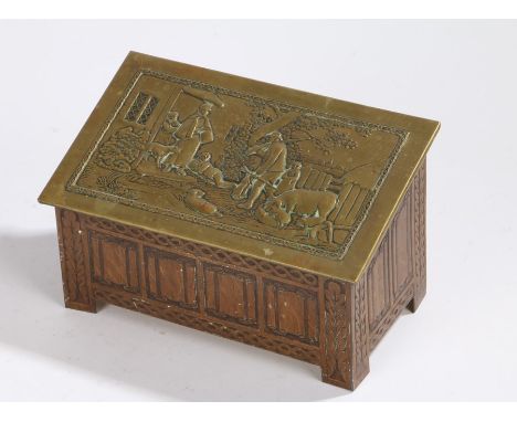 Jacob &amp; Co brass biscuit box, in the form of a coffer, the embossed brass cover depicting a farmyard with figures above a