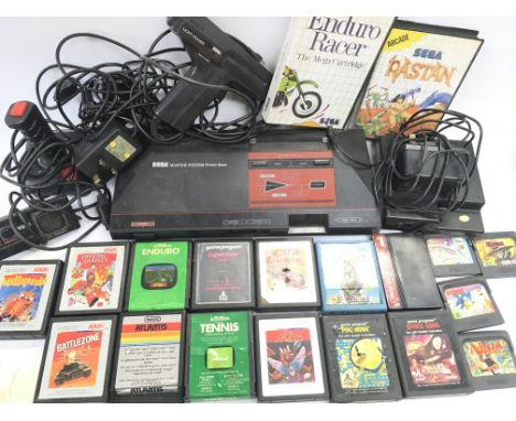 A Sega Master System with accessories and various Console Games.