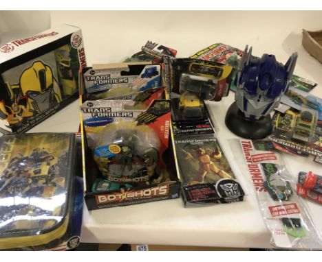 Box of assorted transformers items..including figures..watches..toothbrush..filled pencil case..clock..mainly all unopened in