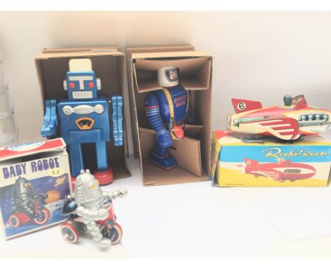 A Collection of 4 Boxed Chinese tinplate Toys. A Baby Robot. A Space Man and a Rocket Racer.