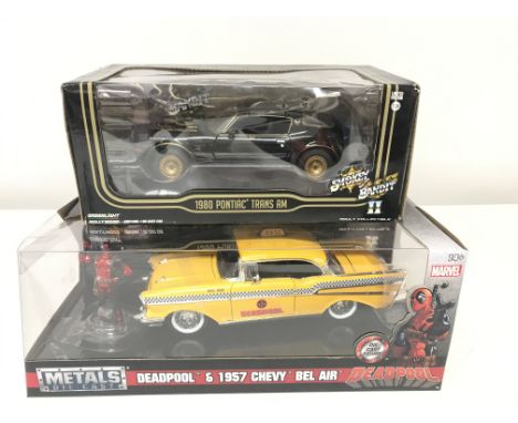 A Boxed Greenlight Smokey and The Bandit 1980 Pontiac Trans Am 1/24 Scale and a Jada Deadpool 1957 Chevy Bel Air.