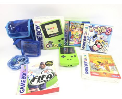 A Boxed Nintendo Game Boy Color. (Green) with 4 Boxed Games and a Light Mag.