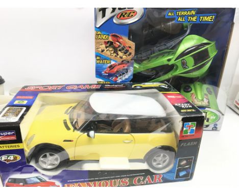 A Boxed Tyco R/C Terrain Twister and a He Tai Toys R/C Mini.(2).