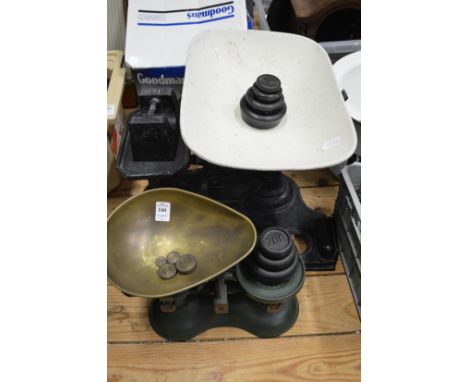 Two sets of kitchen scales with weights.