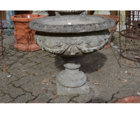 A good large reconstituted stone pedestal urn shaped planter.