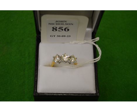 A good 18ct gold and diamond three stone ring, size P.