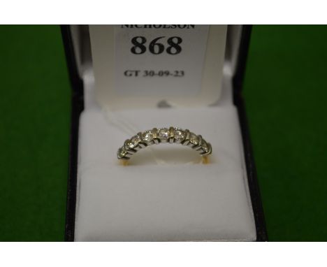 An 18ct gold and diamond seven stone ring, size Q.