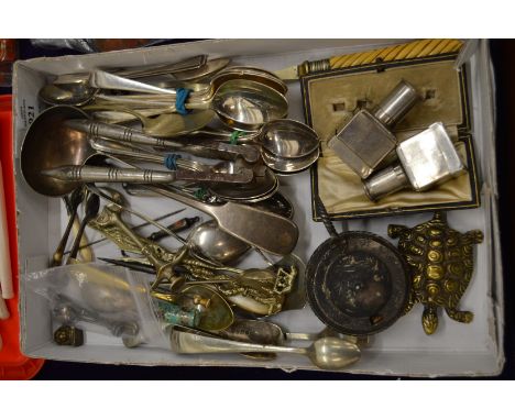 A small collection of plated items to include button hook, sugar tongs etc.