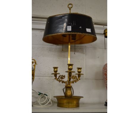 A decorative ormolu table lamp with toleware style shade.