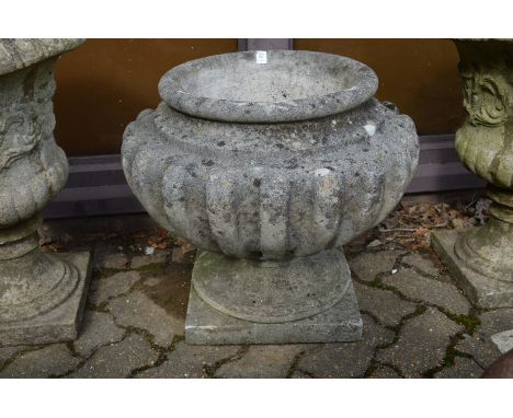 A good large reconstituted stone pedestal planter.