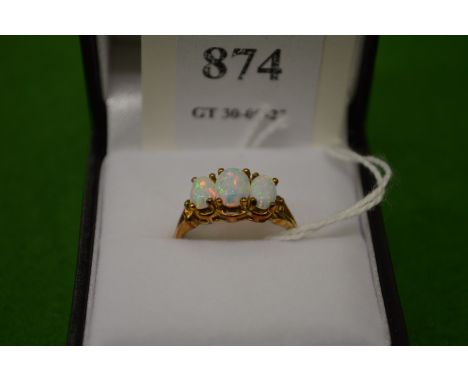 A 9ct gold and opal three stone ring, size M½.