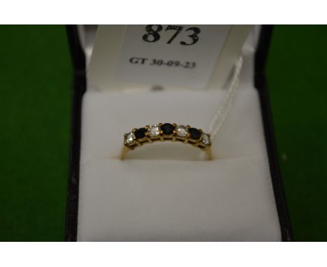 A 9ct gold, diamond and sapphire seven stone ring, size R½.