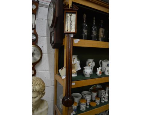 A reproduction mahogany stick barometer by  Comitti &amp; Son, London.