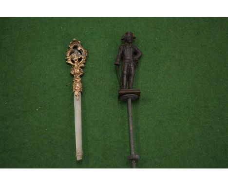 Miniature model of Napoleon and another item.