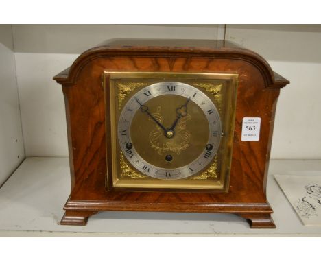 An Elliott walnut cased mantle clock.