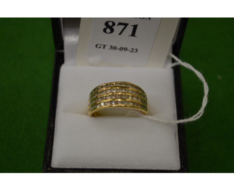 An 18ct gold and diamond four band ring, size N½.