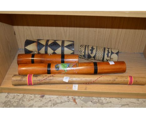 A collection of Aboriginal rain tubes and other musical instruments.
