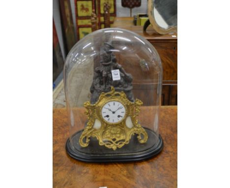 A 19th century French spelter and ormolu figural mantle clock housed under a glass dome.