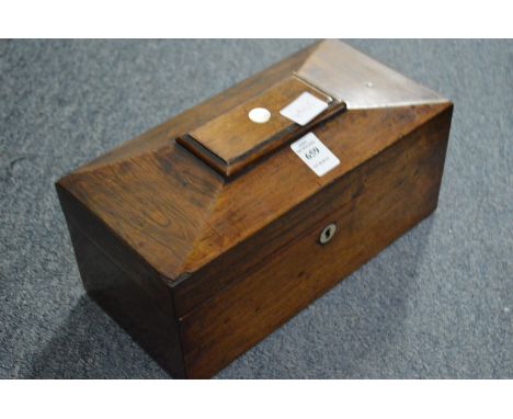 A Victorian rosewood sarcophagus shaped tea caddy.
