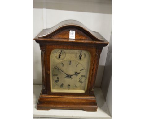 A large oak cased mantle clock.