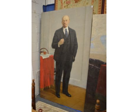 Russian School, Full length portrait of Lenin standing by a table, oil on canvas, unframed.