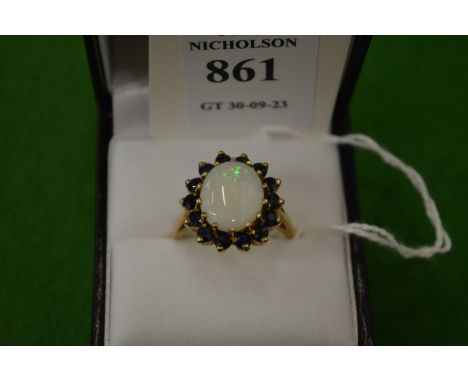 A 9ct gold, opal and gem set ring, size Q½.