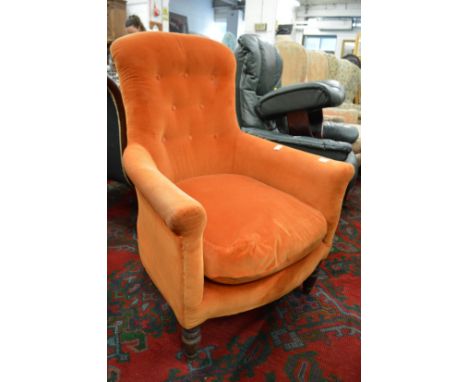 A Victorian button upholstered armchair.