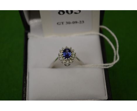 An 18ct white gold, diamond and tanzanite ring, size M.