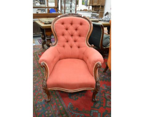 A good Victorian mahogany framed button upholstered armchair.