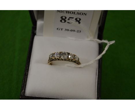 An 18ct gold and diamond five stone ring, size L½.