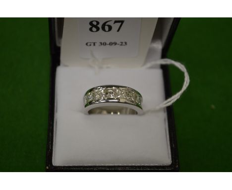 An 18ct white gold and diamond pave set seven stone diamond ring, size M½.