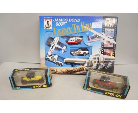 A 007 James Bond boxed Matchbox set Licence to Kill and two Bull Nose Morris 266 Spot-on Triang cars in yellow and red 