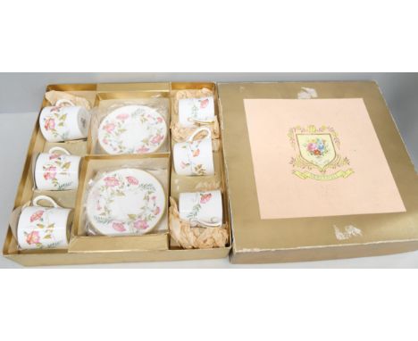 A Staffordshire Fenton bone china part tea service, comprising five teacups, six small plates, three dinner plates, milk jug 