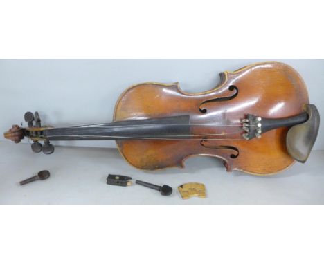 A 19th Century full size 4/4 violin with two piece back and ebony fingerboard. Interior label 'Antonius Stradivarius Cremonen