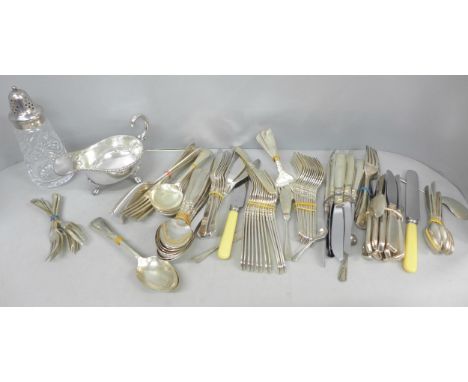 A collection of silver plated items to include flatware cutlery sets, a plated jug and sugar castor