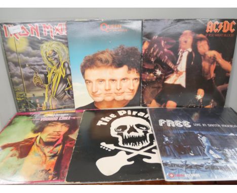 Fifteen vinyl LP records mostly rock, artists include Iron Maiden, Jimi Hendrix, Queen, ACDC and more