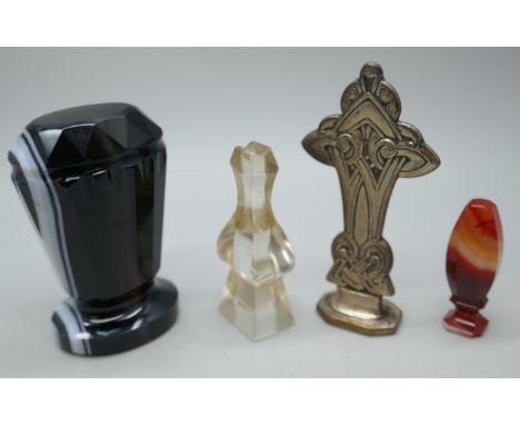Two agate wax seals, a clear glass example and a Celtic design example. Tallest measures approximately 7cm.