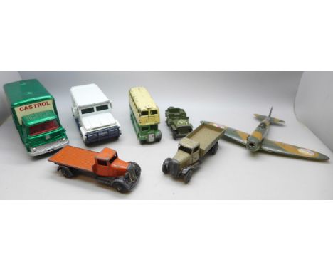 A collection of Dinky toys to include bus, Castrol lorry, Brink's van, and aircraft, along with other examples