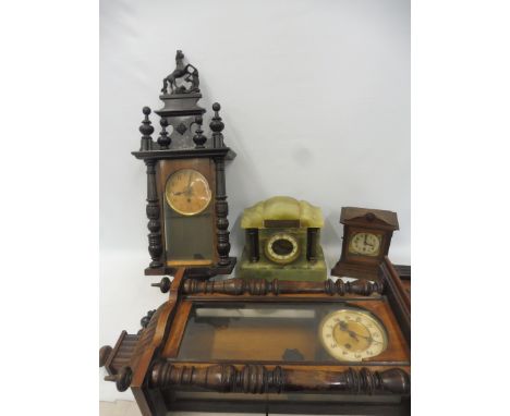 A Vienna-style regulator, a second wall clock plus two mantle clocks.