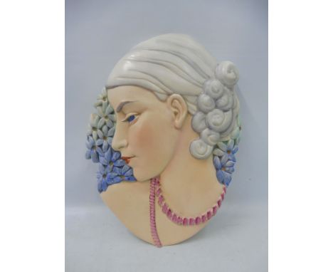 A Beswick Art Deco style brightly coloured wall plaque of a lady in side profile, 23 x 31cm, numbered 8187 to the verso.