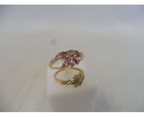 A 1/4ct diamond 9K gold ring, size N to O, approx 1.8g and an Imperial pink topaz and diamond 9K gold ring, size R to S, appr