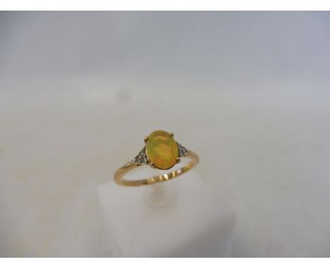 An Ethiopian opal and diamond 9K gold ring, size N to O, with authenticity certificate, approx. 1.9g.