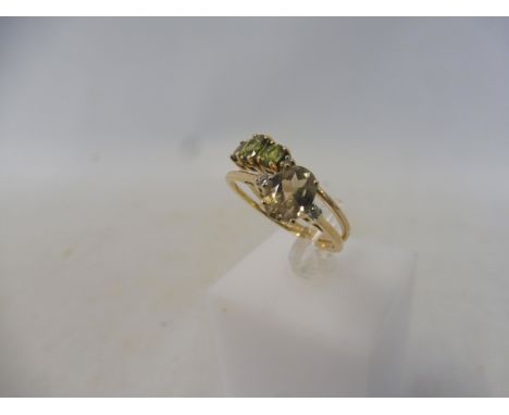 A green sapphire three stone 9K ring, size R to S, approx 1.6g and a Turkish Csarite and white zircon 9K ring, size T to U, a