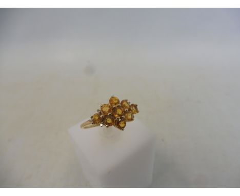 A Songea yellow sapphire and diamond 9K gold ring, size R to S, with authenticity certificate, approx 1.7g.